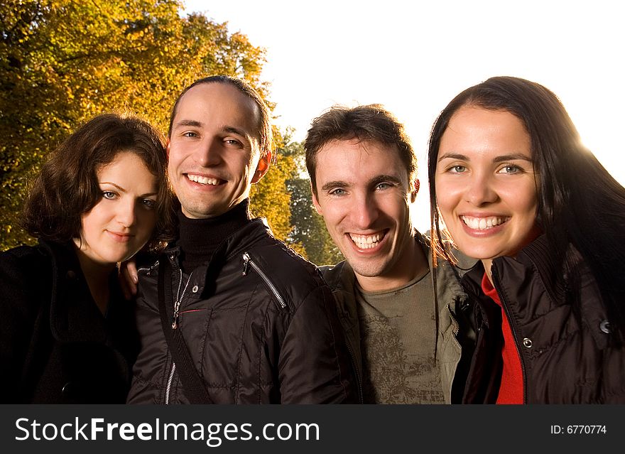 Friends having fun outdoors (autumn time)