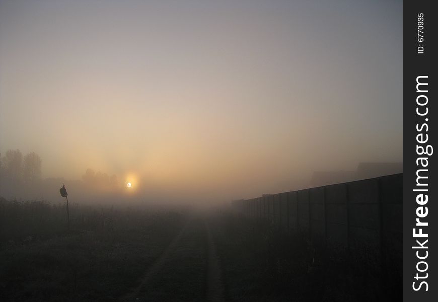 Sun rising in the fog.Foggy morning.