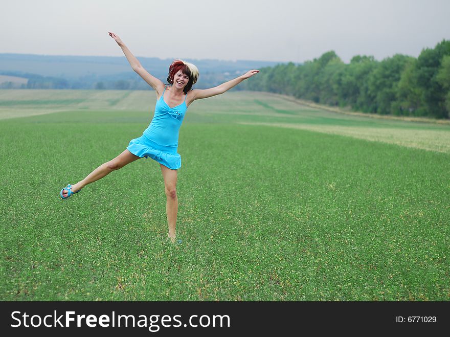 Young Woman And Green Field