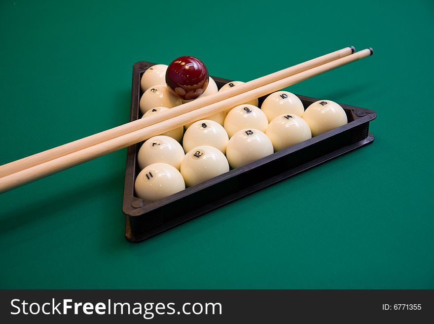 Billiard set on green table close-up image