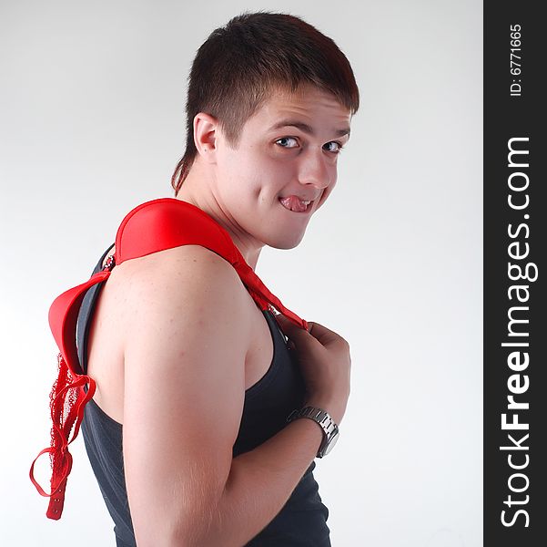 Portrait of attractive fun man with red bra. Portrait of attractive fun man with red bra