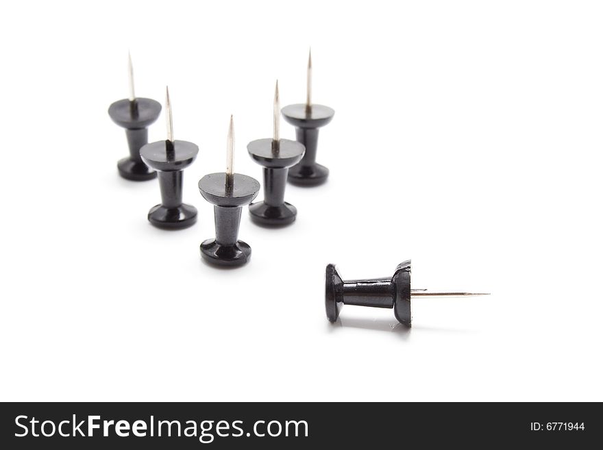 Isolated group of black drawing-pins