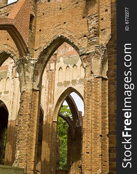 Ruined medieval castle in Latvia on a background of the blue sky