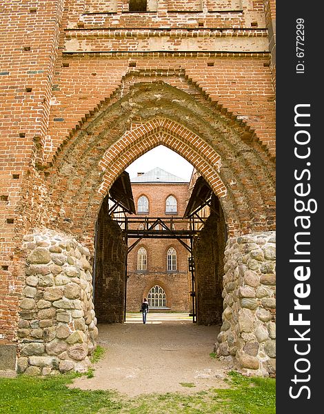 Ruined medieval castle in Latvia on a background of the blue sky