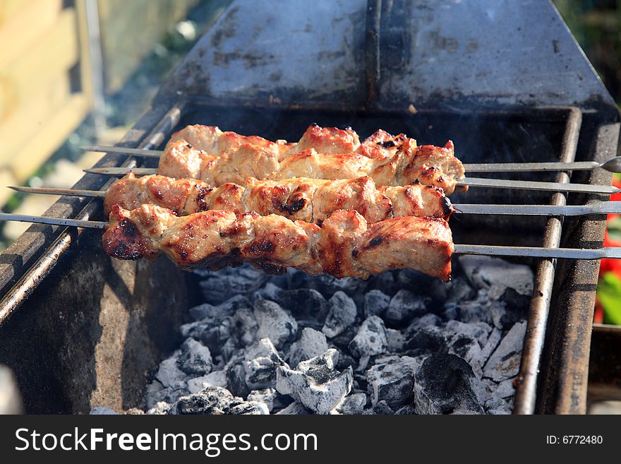 Roasted shish kebab on the grill. Roasted shish kebab on the grill.