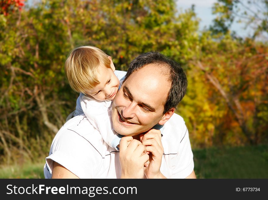 Father and son outdoor portrait. Father and son outdoor portrait