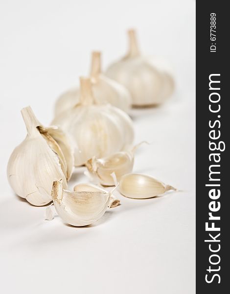 Some garlic over white background, healthy eating