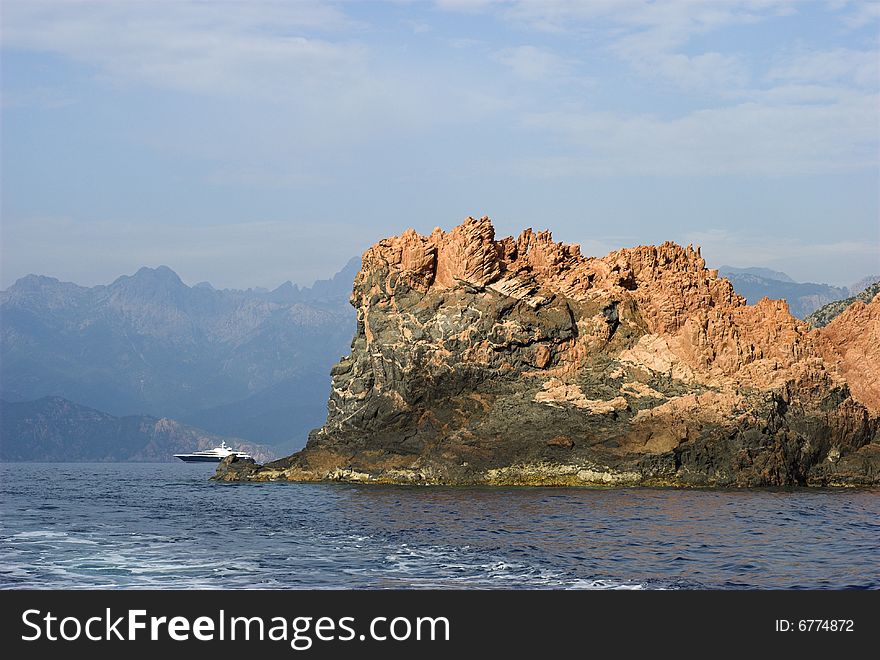 Mountain and Luxury Boat.
Mediterranean Sea, Wake, Boat  and Corsican Mountain Rocks.
Coastline outside Porto, Corse-Du-Sud, Corsica, France