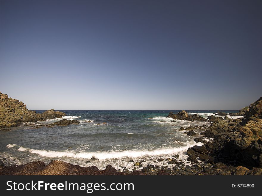 Mediterranean Rocky Beach.
Where the waves crash against the rock cliff