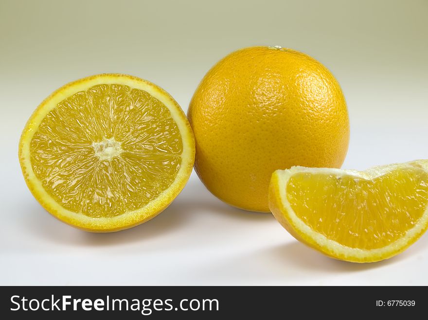 Orange and orange slices isolated on a plain background. Orange and orange slices isolated on a plain background