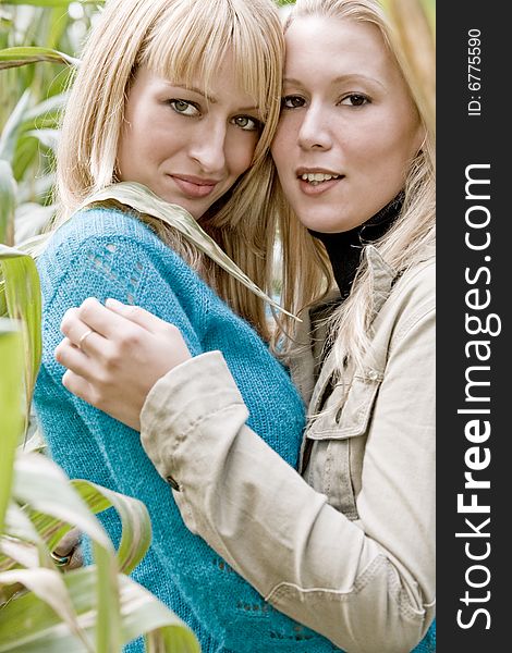 Two sisters in a park having fun. Two sisters in a park having fun