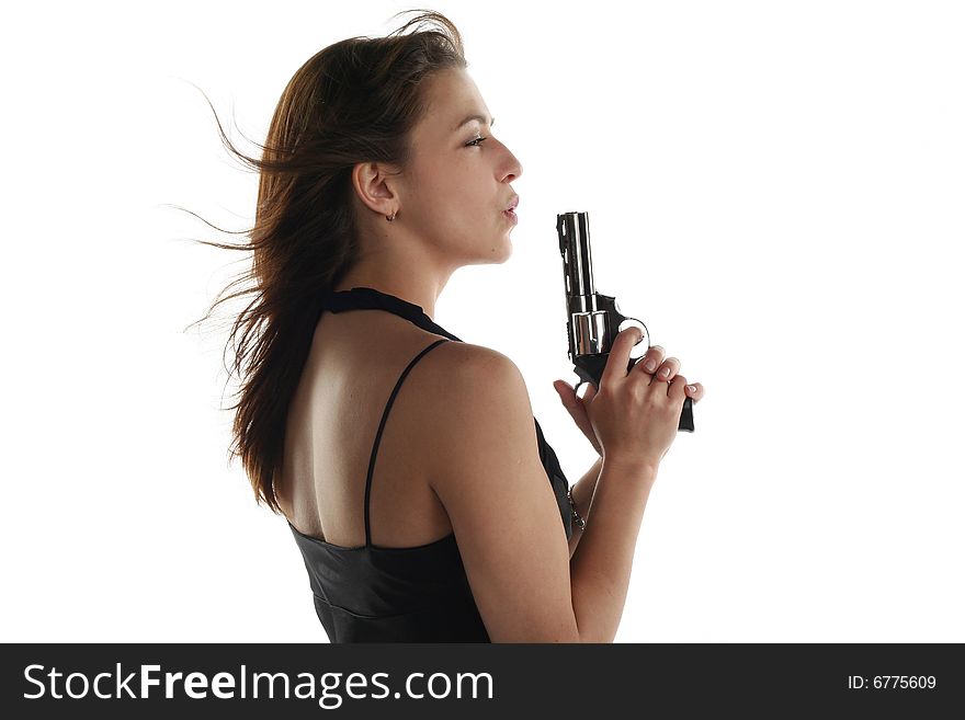 Young woman with revolver isolated on white background