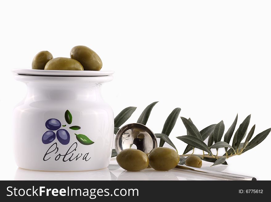 Antipasti - olives branch with olive oil on white