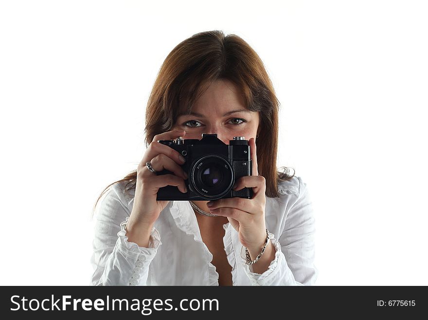 Young woman with old camera isolated on white background