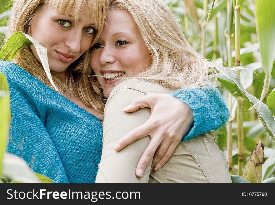 Two sisters in a park having fun. Two sisters in a park having fun