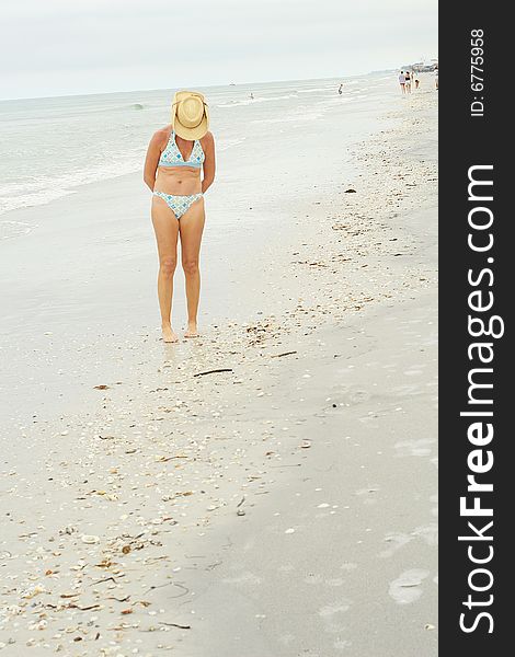 Cowgirl In Bikini Looking For Sea Shells