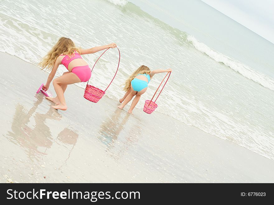 Children picking up shells