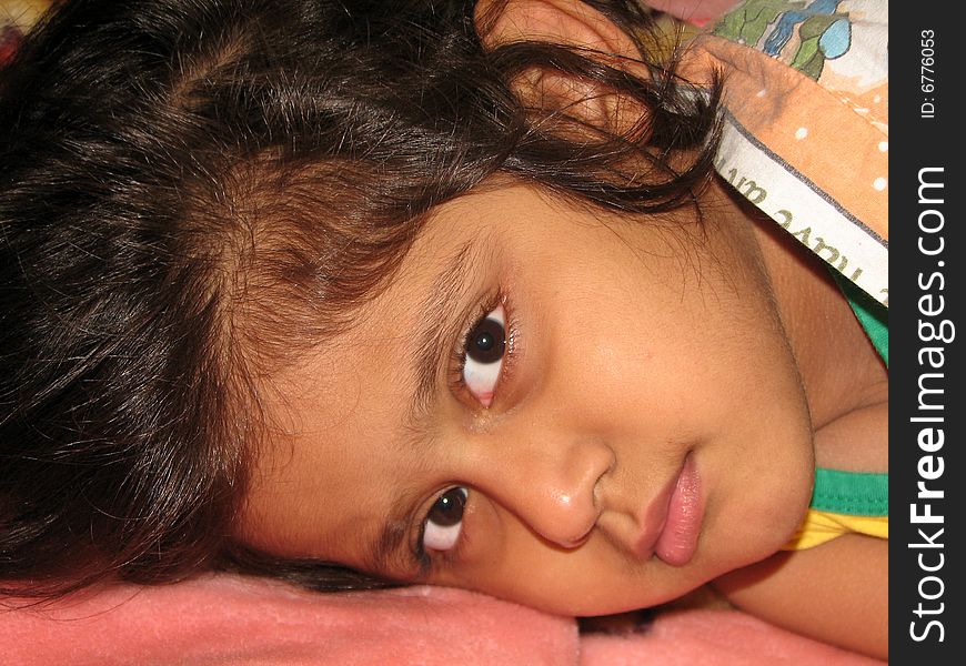 Sleepy Little Girl lying on the bed. Sleepy Little Girl lying on the bed