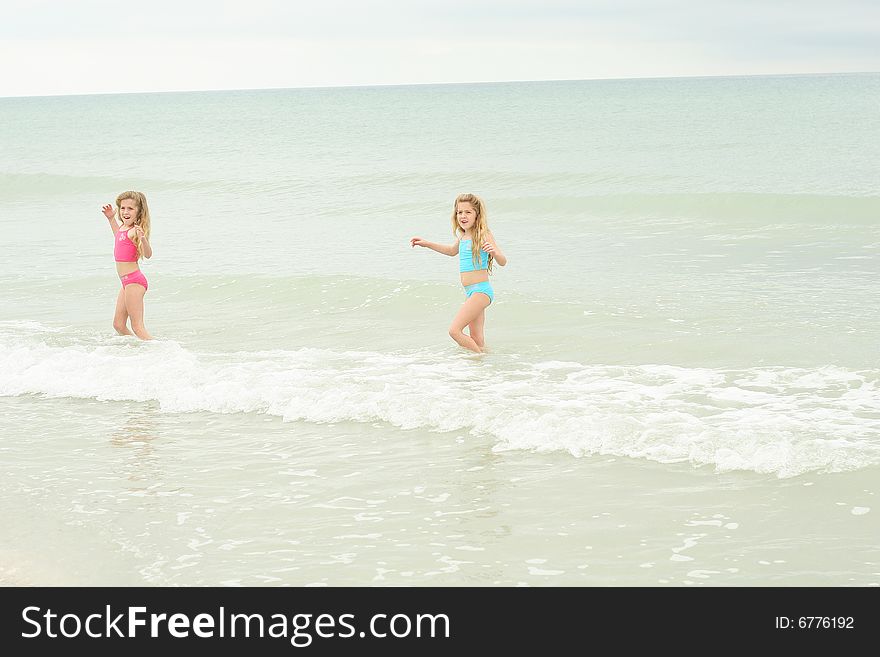 Twin sisters at the beach