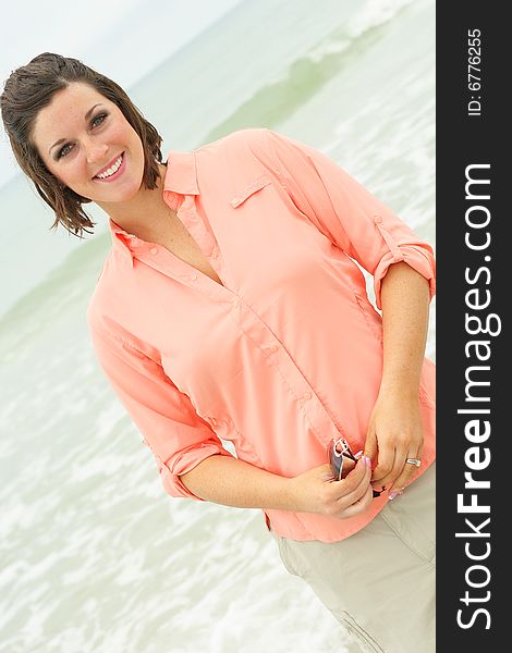 Shot of a gorgeous brunette at the beach