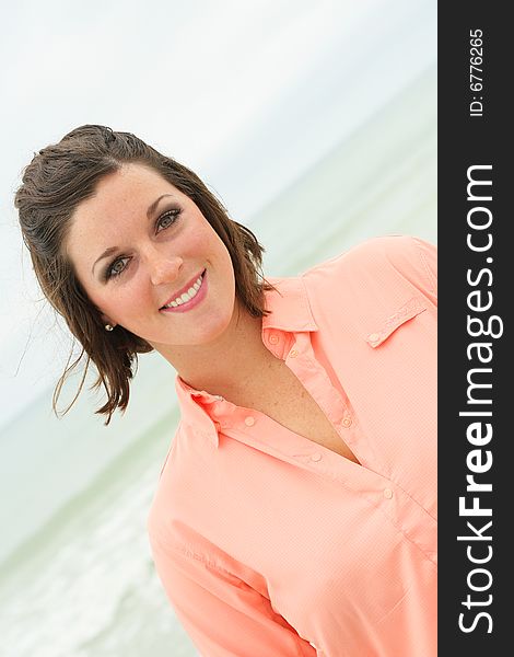 Gorgeous brunette headshot at the beach