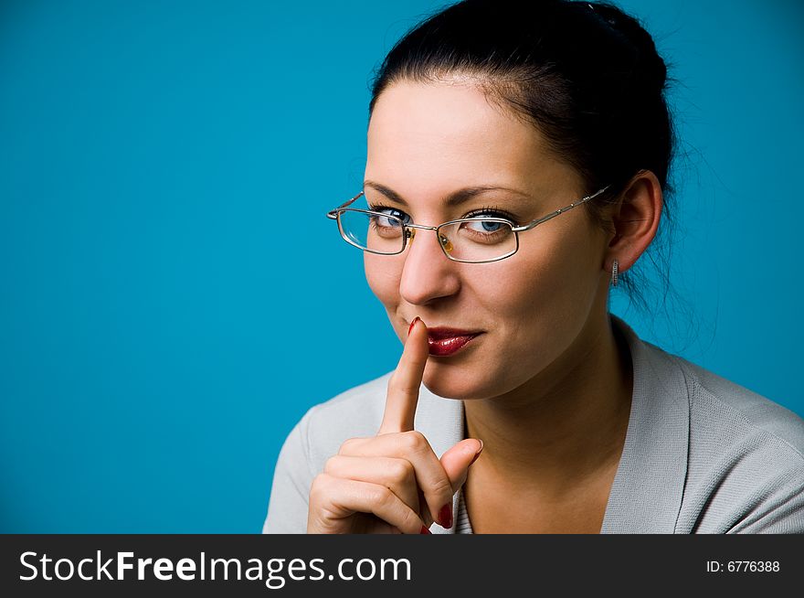 The woman in points on a dark blue background