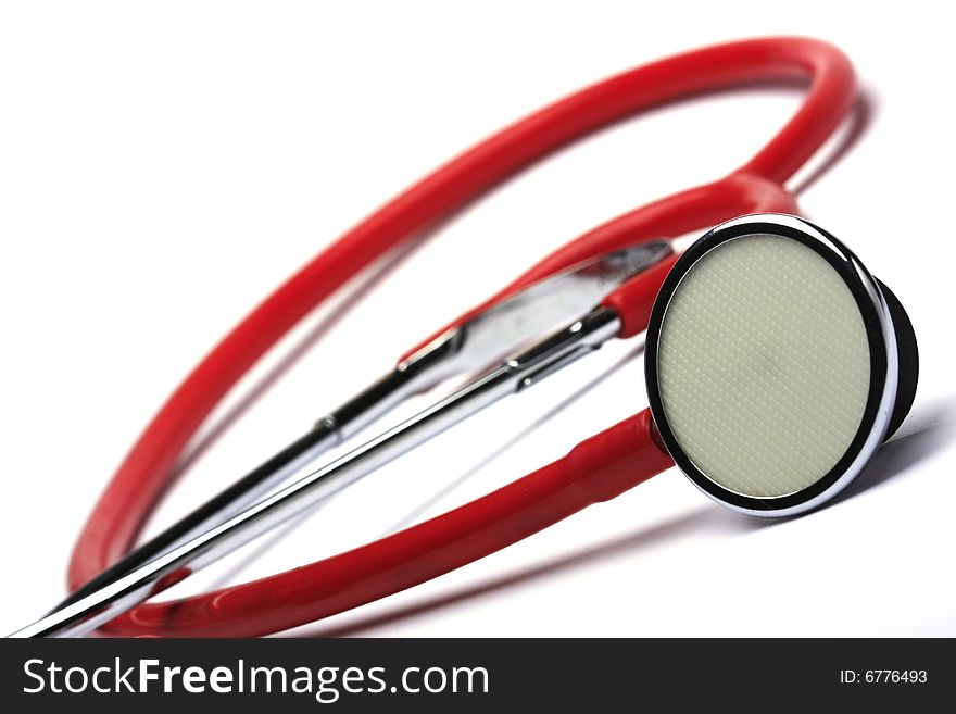 Red stethoscope isolated in white background