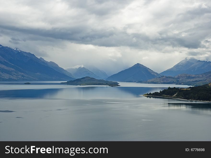 View of Lake Wakatipu near Queenstown, South Island, New Zealand  in a moody day. View of Lake Wakatipu near Queenstown, South Island, New Zealand  in a moody day