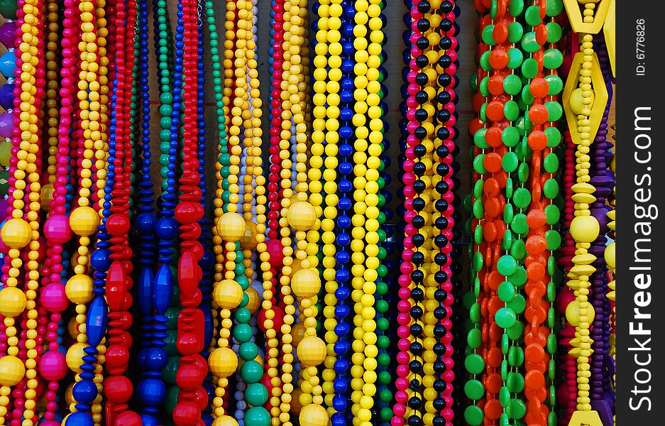 Many colored strands of beads in a romanian shop. Many colored strands of beads in a romanian shop