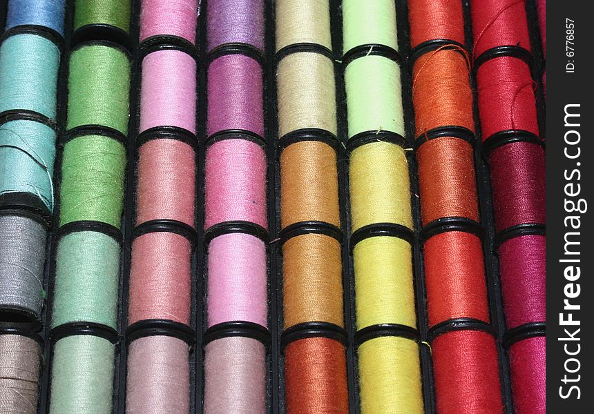 A group of assorted colored cotton rolls