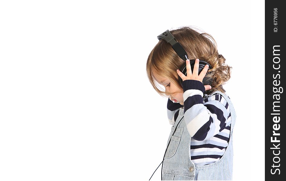Beauty a little girl listening music on white background