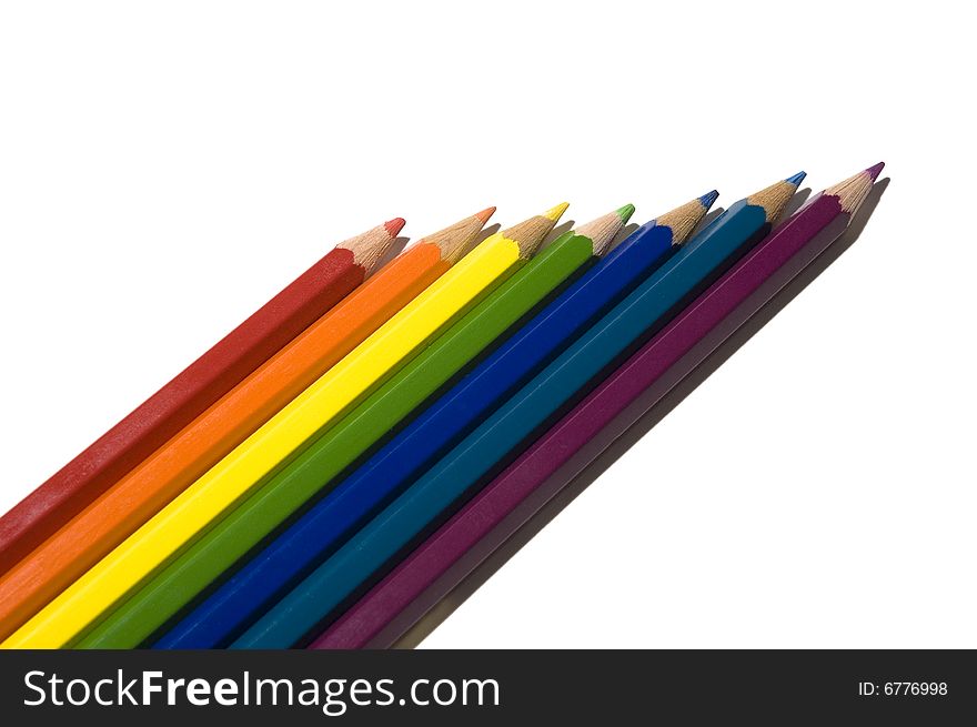 Seven colored pencils isolated on white