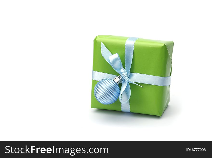 Green present box with blue ribbon isolated on white background. Green present box with blue ribbon isolated on white background