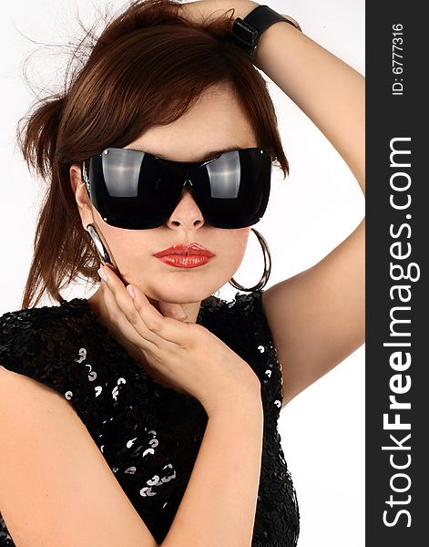 Portrait of the attractive brunette in sun glasses