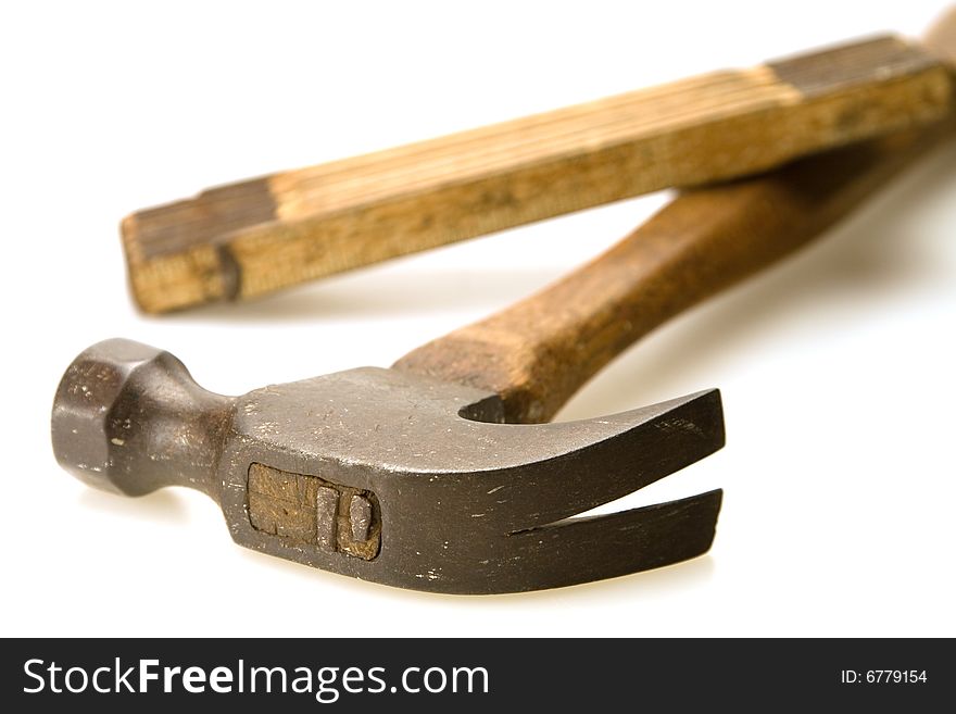 Old wooden handle hammer and folding ruler. Old wooden handle hammer and folding ruler