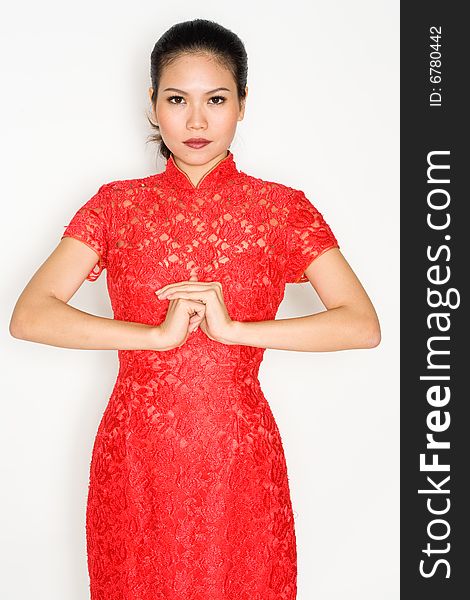 Chinese woman wearing traditional red cheong sam. Chinese woman wearing traditional red cheong sam