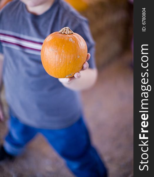 Boy Holding Pumpkin