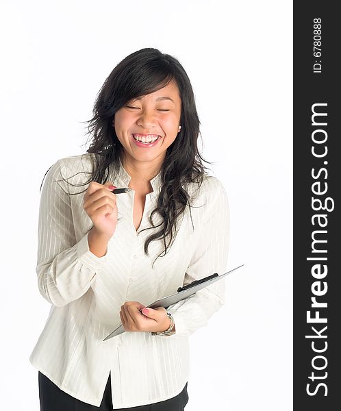 Young woman holding a clip board laughing with glee during her presentation. Young woman holding a clip board laughing with glee during her presentation