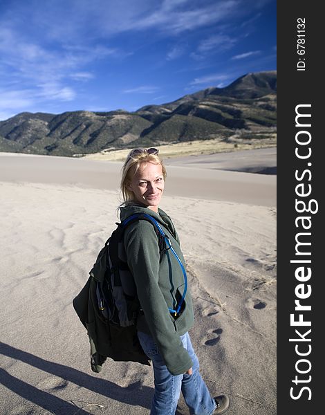 Smiling Hiking Woman On Sand