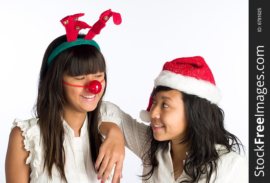 Friends in funny head wear at a Christmas party. Friends in funny head wear at a Christmas party