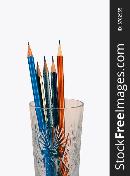 Drawing pencils in a glass on a white background