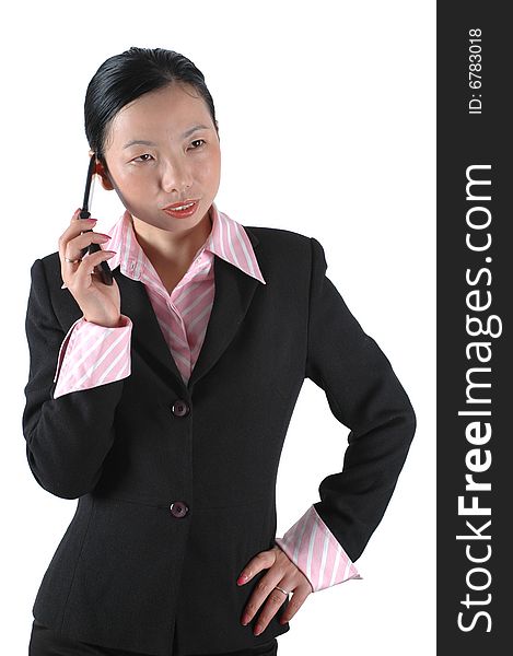 Chinese businesswoman, wearing lady's suit and shirt. Using mobile phone. Chinese businesswoman, wearing lady's suit and shirt. Using mobile phone.