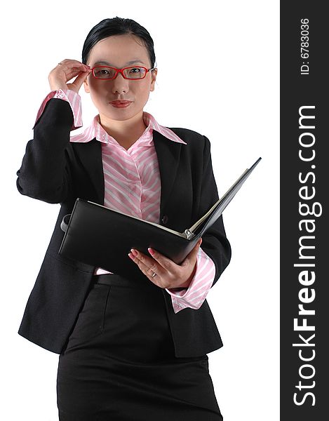 Chinese businesswoman, wearing lady's suit and shirt.  Holding documents. Chinese businesswoman, wearing lady's suit and shirt.  Holding documents.