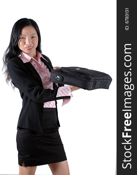 Chinese businesswoman, smiling and holding briefcase, laptop bag, wearing lady's suit and shirt. Chinese businesswoman, smiling and holding briefcase, laptop bag, wearing lady's suit and shirt.