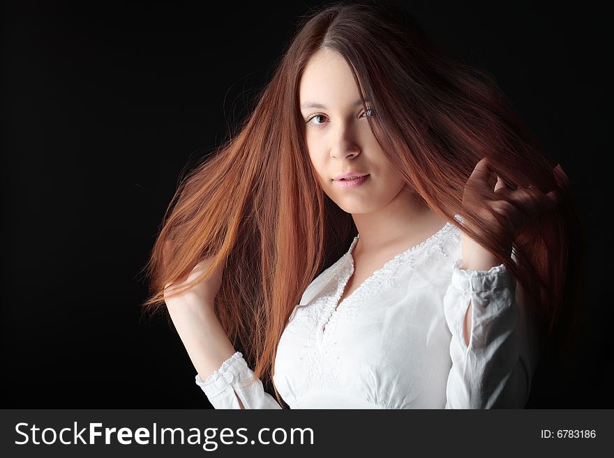 Girl with long hair lightly fluttering in the wind. Girl with long hair lightly fluttering in the wind