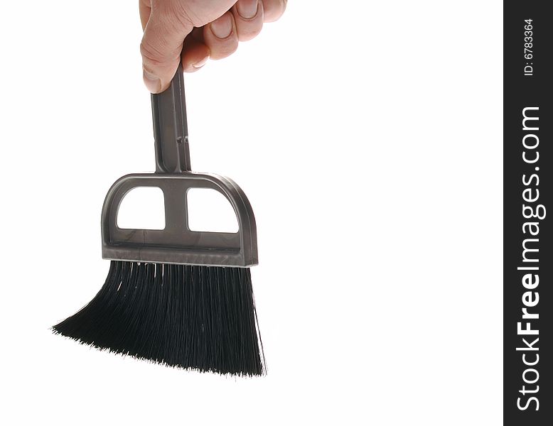 Brush in man hand. The tool for cleaning it is isolated on a white background