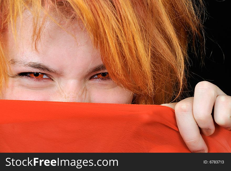 Portrait of Beautiful red girl with red eyes on black background