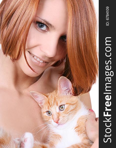 Beautiful redhead girl with red fluffy kitten. Beautiful redhead girl with red fluffy kitten