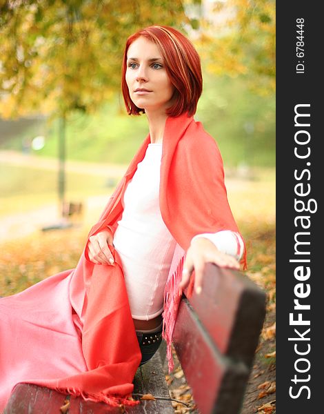 Young girl relaxing in autumn park. Young girl relaxing in autumn park