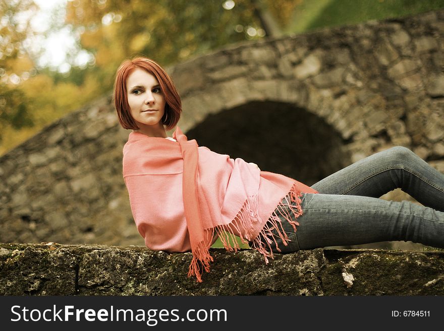 Young girl relaxing in autumn park. Young girl relaxing in autumn park